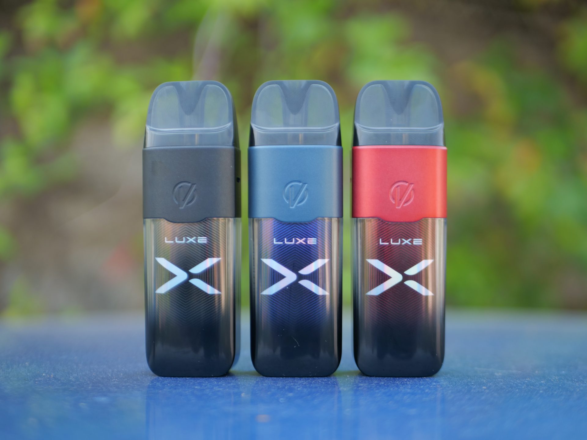 A Picture Showing 3 Colours Of One Of Our Top Pod Kits Of 2023, The Vaporesso Luxe X